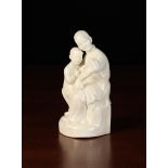 A Chinese Republic White Glazed Figure Group moulded as a woman sat with child on her lap, 7" (17.