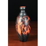 A Delatte Nancy Cameo Glass Art Vase with carved black glass overlay depicting irises displayed
