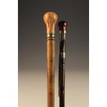 Two Gentleman's Walking Canes: One having an agate knop handle and engraved silver mounts with