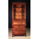 A 20th Century Carved Chinese Bureau Bookcase.