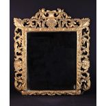 A Large Rectangular Wall Mirror in an 18th Century open-carved giltwood frame of undulating foliate