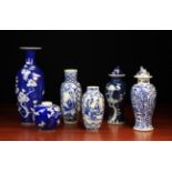 Six Pieces of Oriental Blue & White China: A slender baluster vase with a narrow neck and flared