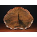 A George II Mahogany Cartouche Tray with raised moulding to the serpentine edge,