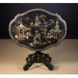 A Victorian Black Lacquered Tilt Top Table elaborately decorated with mother-of-pearl inlay and