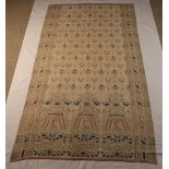 An Antique Embroidered Mulsin Drape woven with repeated Egyptianesque motifs in beige enhanced with