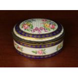A 19th Century Continental Porcelain Trinket Box of oval form.