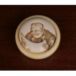 A Signed 19th Century Kagamibutu Style Manjŭ Netsuke carved with Benkei reading his scroll
