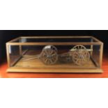 A Fine Model Cannon in a Glazed Oak Display Case with brass plaque inscribed;
