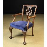 An 18th Century Style Mahogany Armchair having a pierced back splat carved with interlaced straps,