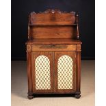 A Fine Quality Regency Rosewood Chiffonier inlaid with scrolling brass embellishments and stringing.