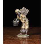 An Austrian Cold Painted Bronze Figure of an Arab man carrying a hat box & umbrella in one arm,