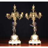 A Pair of 19th Century Louis XVI Style Figural Bronze Candelabra.