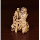 A Fine 19th Century Netsuke carved in detail with depiction of Shunkosai with staff on a rockwork