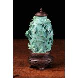 A Small Chinese Carved Turquoise Vase with hardwood lid & stand.