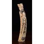 A Large Late 19th Century Meiji Period Ivory Carving of Sage Confucius wearing a layered head dress