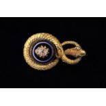 A Fine 18 Carat Gold Mourning Brooch fashioned as a scrolling snake set with bullseye agate and