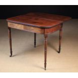 A George IV Mahogany Fold-over Tea Table standing on slender turned legs with brass caps & castors,