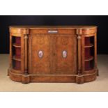 A Victorian Burr Walnut Credenza inlaid with decorative stringing and edged in gilt beading.