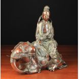 A Fine Reddish Brown Patinated Bronze Guanyin Samantabhadra sat upon a recumbent Elephant.