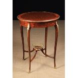 A Louis XVI Style Table Ambulant inlaid with parquetry and having gilt bronze mounts.