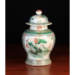 A Famille Verte Baluster Vase & Cover decorated with ducks amongst flowering lotus to one side and
