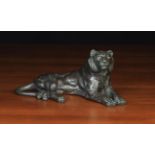A Japanese Bronze Study of a Reclining Lion 11" (28 cm) in length.
