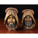 A Pair of Carved & Polychromed Wooden Wall-mounted Heads of Arabian Nomads, 8½ in (22 cm) in height.