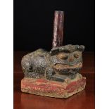 An Unusual Antique Carved & Painted Stone Support in the form of a crouching mythical beast with