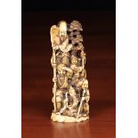 A 19th Century Carved Walrus Tusk Okimono depicting The Seven Gods of Luck & Good Fortune climbing