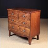 A Late Georgian Mahogany Chest of Drawers. The rectangular top inlaid with ebony stringing.