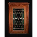 A Large Late Georgian Mahogany Corner Cupboard inlaid with decorative chequer bands and stringing.