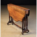 A Victorian Walnut Sutherland Table.