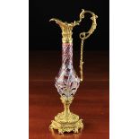 A Small Ruby Flashed Cut Glass Ewer with Gilt Bronze Mounts and paper label to underside Susse