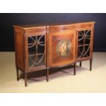 A Late 19th/Early 20th Century Acajou Mocheté Break-Bowfront Side Cabinet inlaid with stringing and