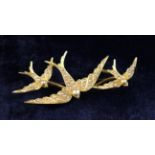 A Victorian 15 Carat Gold & Seed Pearl Brooch in the form of three swallows.