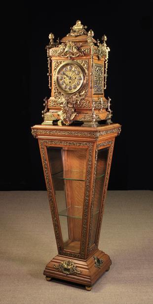 A Large & Highly Decorative Late 19th Century Gilt Mounted Oak Clock raised on a pedestal display