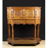 A 16th Century and Later Renaissance Carved Oak & Fruitwood Buffet of canted form.