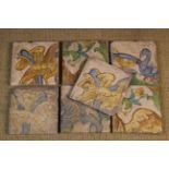 Seven Late 16th/Early 17th Century Maiolica Polychrome Tiles decorated with a blue ribbon, flowers,