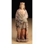 A 14th Century Carved & Polychromed Stone Statue of Madonna (A/F).