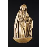 A 17th Century Flemish Oak Relief Carving of Saint Anne, 17" (43 cm) high, 8" (20 cm) in width.