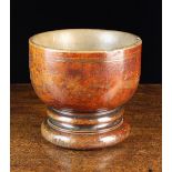 A Large Antique Turned Treen Mortar/Bowl raised on a moulded foot with turned hollow to the