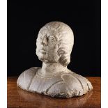 A Fine Early 15th Century Carved Stone Bust of a Roman youth, 13" (33 cm) in height.