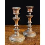 A Pair of Late 18th/Early 19th Century Turned Oak Candlesticks having waisted urn knopped stems on