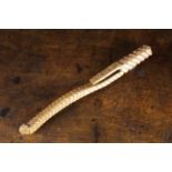 An Antique Carved Ash Knitting Sheath of curved square section,
