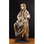 A 15th Century Wood Carved Sculpture of Saint Bridget of Sweden depicted seated with a book on her