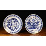 Two Late 18th Century Blue & White Delft Chargers, both decorated with flowers and foliage,