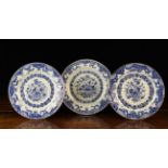 Three 19th Century Blue & White Plates decorated with chinoiserie style baskets of flowers in