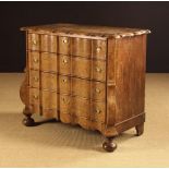 A Late 18th Century Dutch Burr-Walnut Veneered Serpentine Commode Chest with with four long