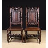 A Pair of Charles II Carved Oak Side Chairs.