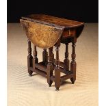 A Small 18th Century Oak Gateleg Table of good colour & patination.